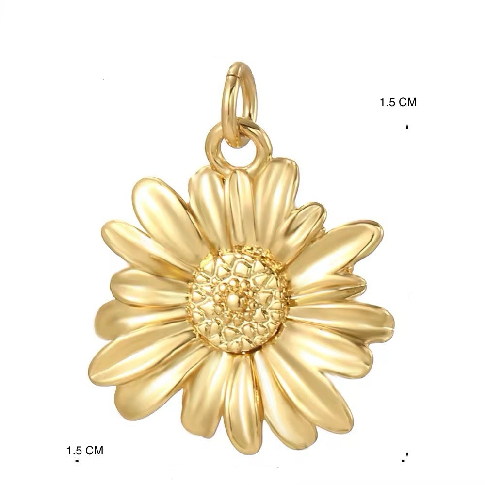 Dije flor dorado